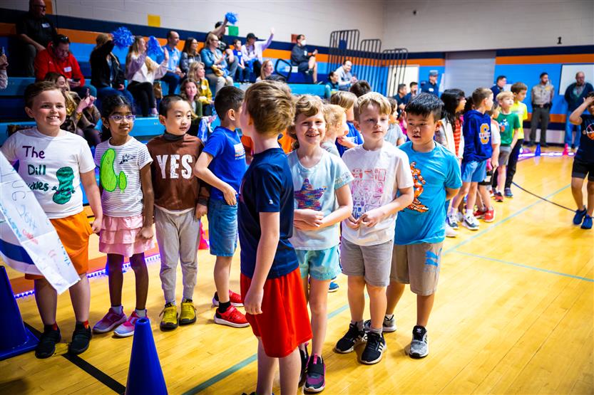 Students and families participate in a fun run